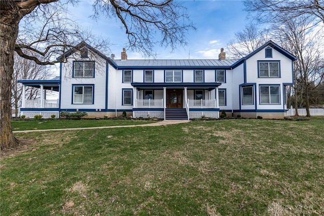 view of front of house featuring covered porch and a front lawn