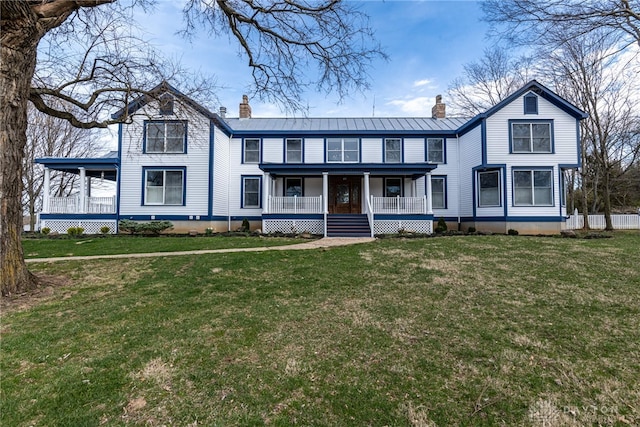 2696 Wilmington Rd, Lebanon, OH 45036 - view of front of home featuring a chimney, a front lawn, and covered porch