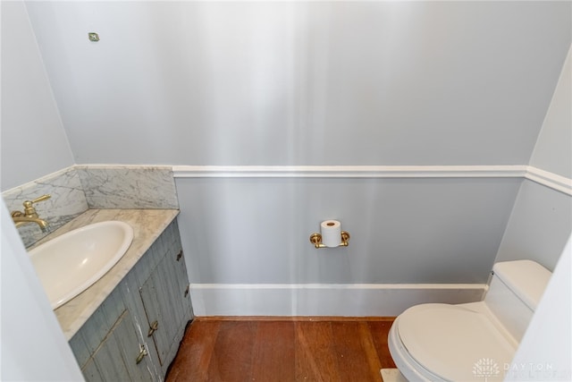2696 Wilmington Rd, Lebanon, OH 45036 - half bathroom with toilet, vanity, and wood finished floors