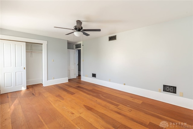 2696 Wilmington Rd, Lebanon, OH 45036 - unfurnished bedroom with baseboards, visible vents, a ceiling fan, a closet, and hardwood / wood-style floors