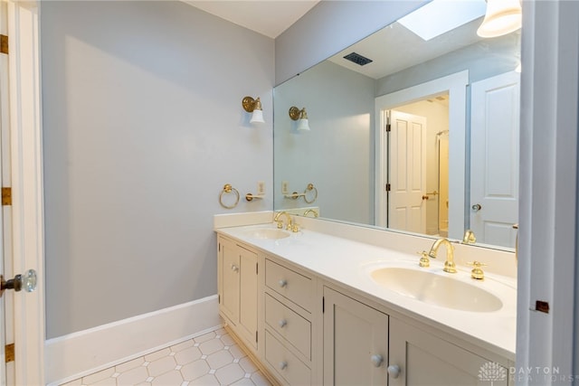 2696 Wilmington Rd, Lebanon, OH 45036 - bathroom featuring double vanity, visible vents, tile patterned floors, and a sink