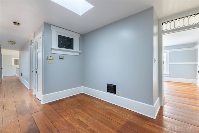 2696 Wilmington Rd, Lebanon, OH 45036 - hallway with a skylight, hardwood / wood-style flooring, and baseboards