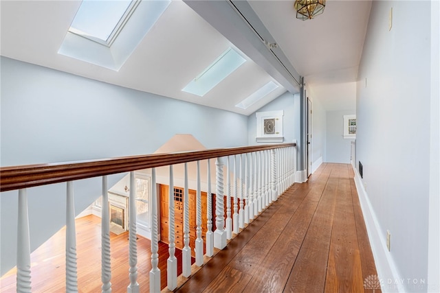 2696 Wilmington Rd, Lebanon, OH 45036 - hallway featuring wood-type flooring and vaulted ceiling with skylight