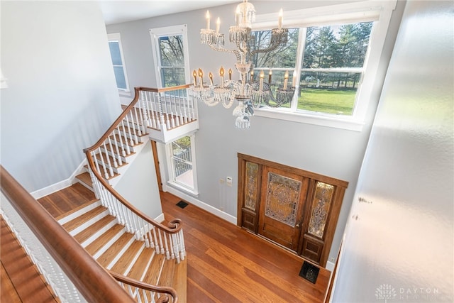2696 Wilmington Rd, Lebanon, OH 45036 - foyer entrance featuring stairs, wood finished floors, visible vents, and a notable chandelier