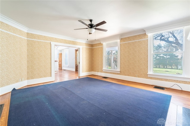 2696 Wilmington Rd, Lebanon, OH 45036 - empty room with visible vents, wallpapered walls, wood finished floors, and ceiling fan