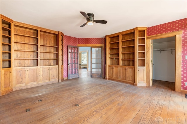 2696 Wilmington Rd, Lebanon, OH 45036 - unfurnished living room featuring wood-type flooring, wallpapered walls, a ceiling fan, and baseboards