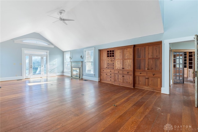 2696 Wilmington Rd, Lebanon, OH 45036 - unfurnished living room featuring a fireplace with flush hearth, vaulted ceiling, wood-type flooring, baseboards, and ceiling fan