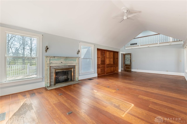 2696 Wilmington Rd, Lebanon, OH 45036 - unfurnished living room featuring lofted ceiling, a ceiling fan, baseboards, a fireplace, and hardwood / wood-style flooring