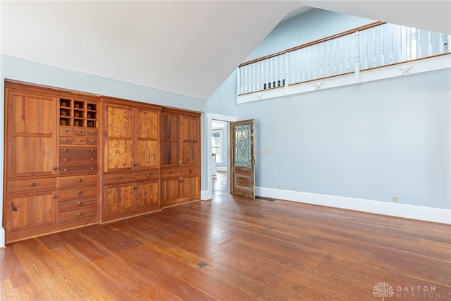2696 Wilmington Rd, Lebanon, OH 45036 - spare room with high vaulted ceiling, wood-type flooring, and baseboards
