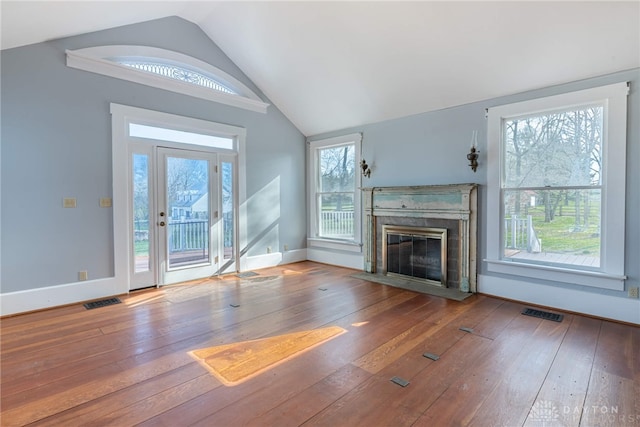 2696 Wilmington Rd, Lebanon, OH 45036 - unfurnished living room with a fireplace with flush hearth, wood-type flooring, lofted ceiling, and visible vents