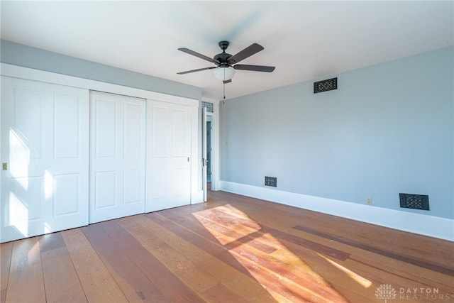 2696 Wilmington Rd, Lebanon, OH 45036 - unfurnished bedroom featuring baseboards, a closet, a ceiling fan, and hardwood / wood-style flooring
