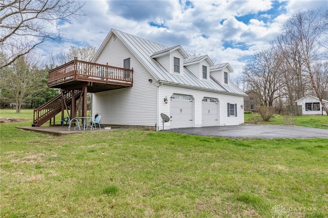 2696 Wilmington Rd, Lebanon, OH 45036 - view of home's exterior with a deck, stairs, a standing seam roof, driveway, and metal roof