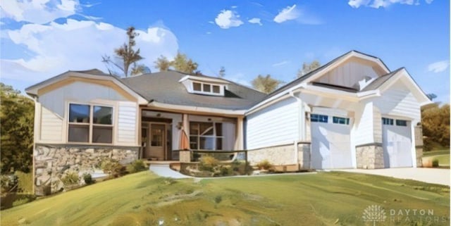 view of front of home with a garage and a front lawn