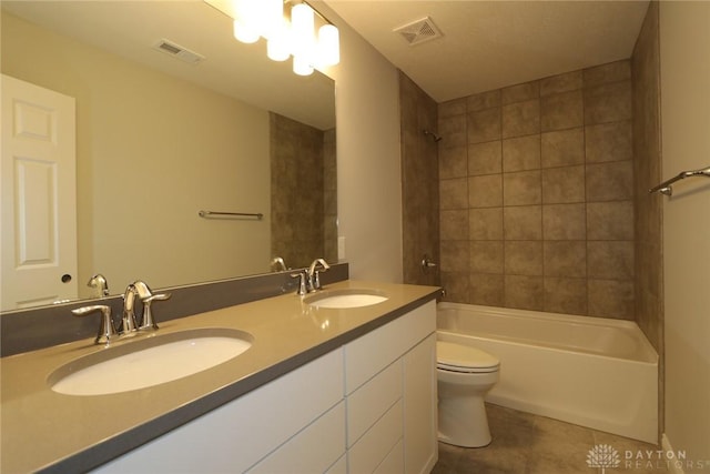 full bath with visible vents, a sink, and tile patterned floors