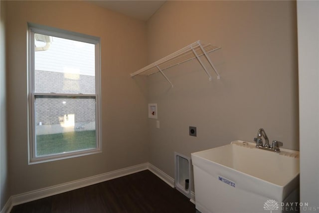 laundry room with hookup for an electric dryer, laundry area, dark wood-type flooring, washer hookup, and a sink