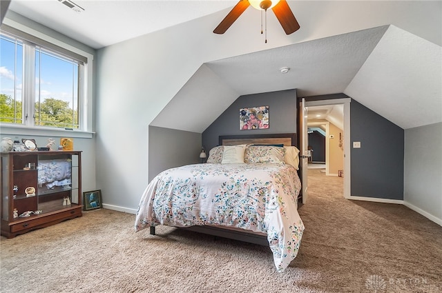 bedroom featuring carpet flooring, lofted ceiling, and ceiling fan