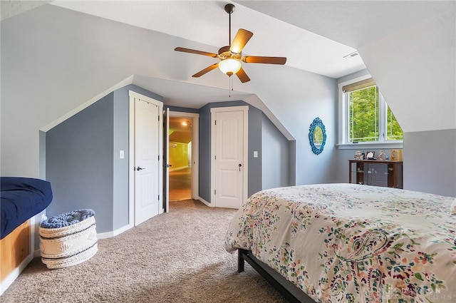 bedroom featuring carpet, lofted ceiling, and ceiling fan