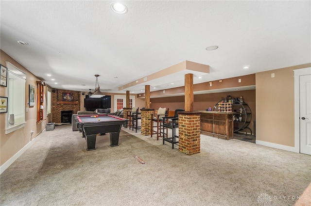 rec room featuring a fireplace, billiards, indoor bar, and carpet