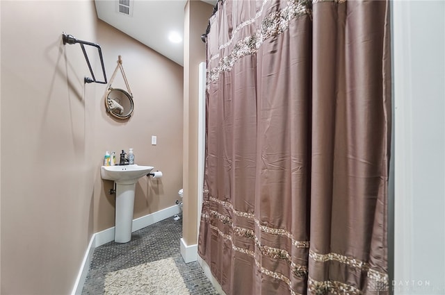 bathroom featuring tile patterned flooring and sink