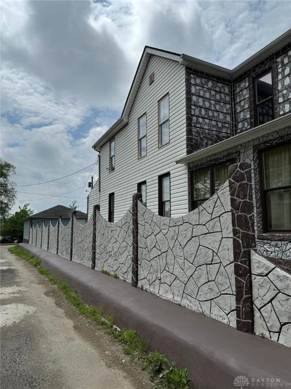 view of property exterior with fence