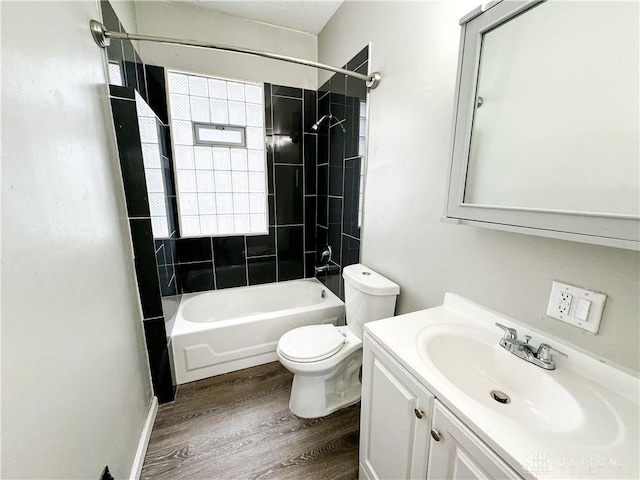 full bathroom with toilet, shower / bath combination, wood finished floors, and vanity
