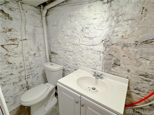 bathroom with toilet and vanity