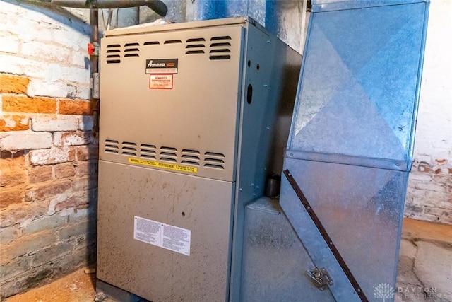 utility room featuring heating unit