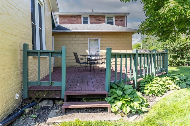 deck featuring outdoor dining area