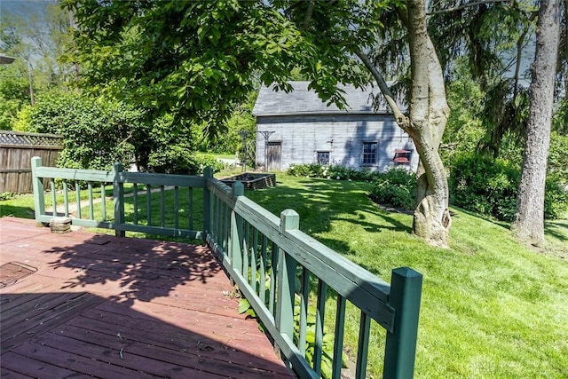 deck featuring fence and a yard