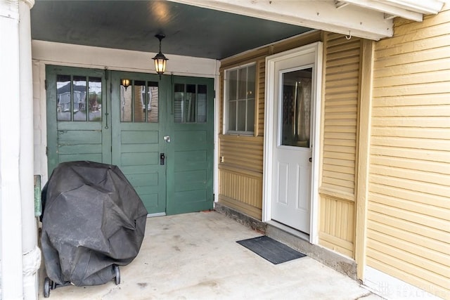 doorway to property with a garage