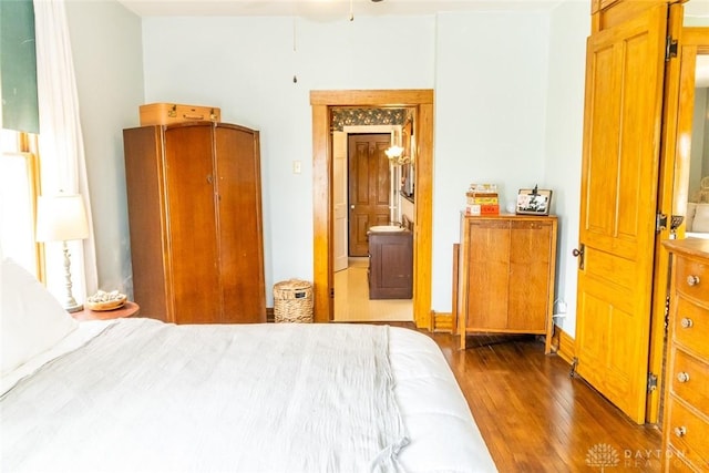 bedroom with wood finished floors