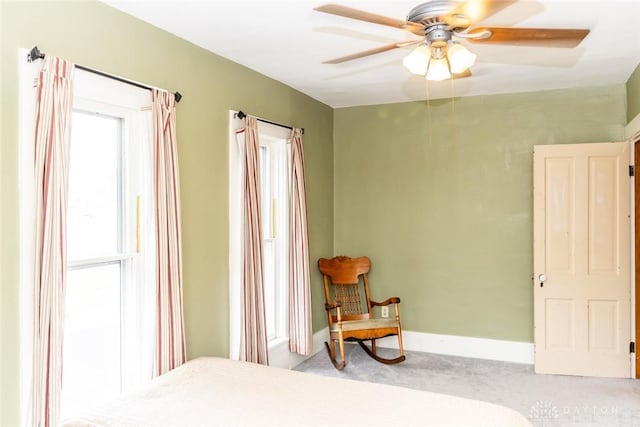 bedroom featuring baseboards, a ceiling fan, and carpet flooring