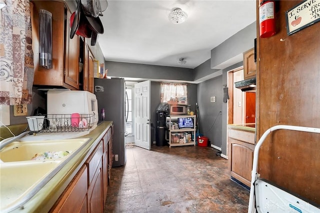 kitchen with appliances with stainless steel finishes and sink