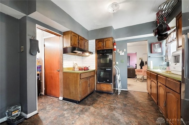 kitchen with backsplash and black double oven