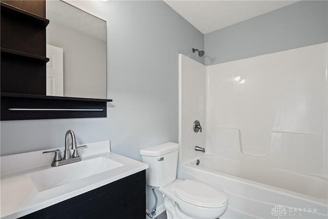 full bathroom with washtub / shower combination, vanity, and toilet