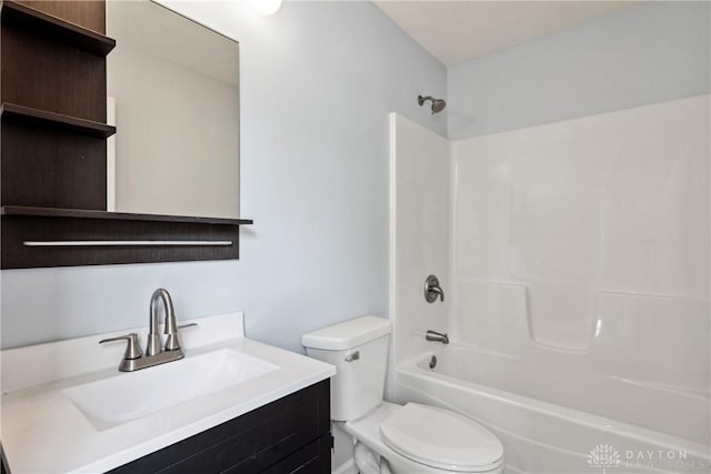 full bathroom with tub / shower combination, vanity, and toilet