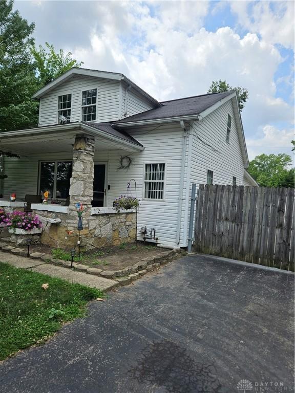 view of front facade with fence and a porch