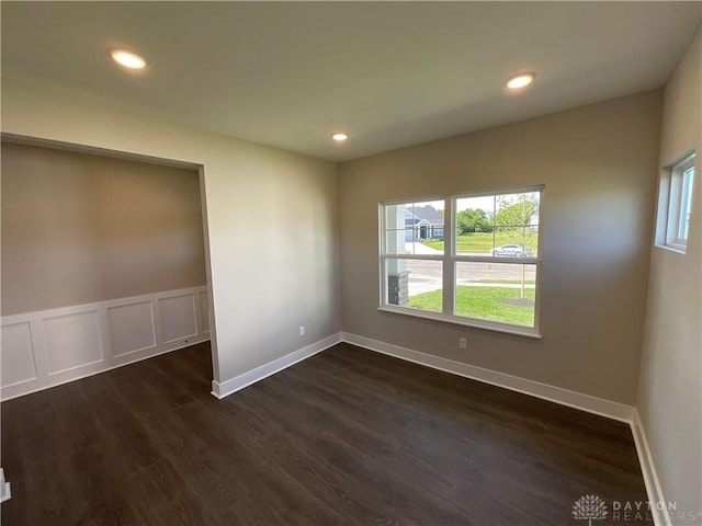 empty room featuring dark hardwood / wood-style flooring