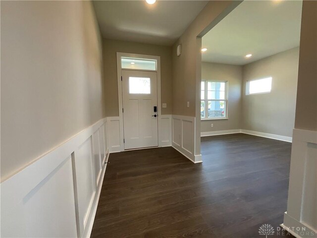 foyer with dark hardwood / wood-style flooring