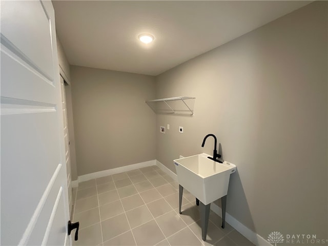 clothes washing area featuring hookup for a washing machine, light tile patterned floors, and hookup for an electric dryer