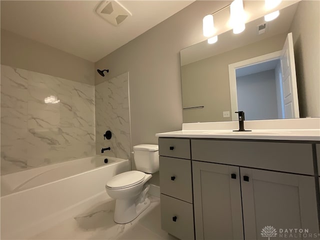 full bathroom with vanity, tiled shower / bath combo, and toilet