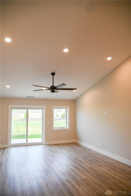 empty room featuring ceiling fan and wood-type flooring