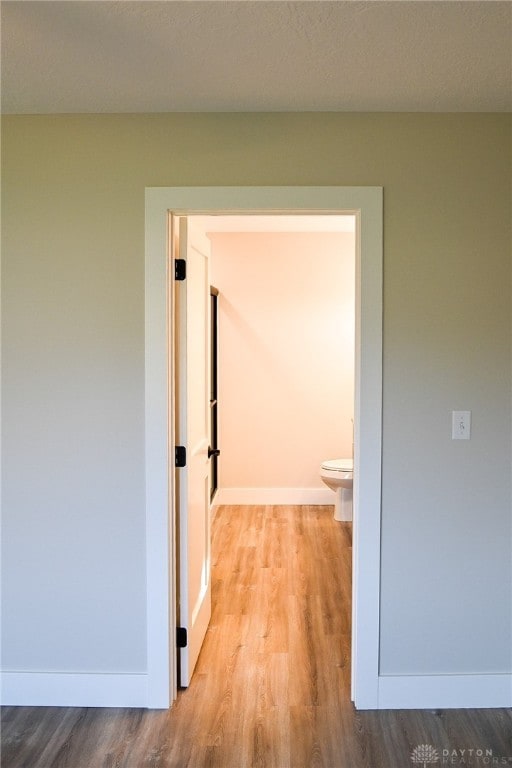 corridor featuring light hardwood / wood-style flooring