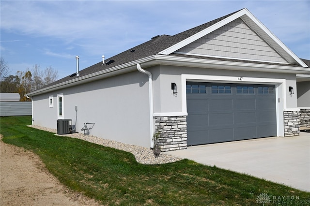 view of home's exterior with a yard and a garage