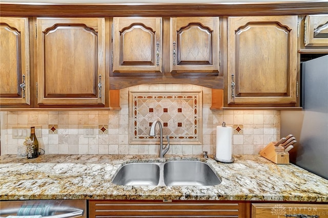 kitchen featuring sink and decorative backsplash