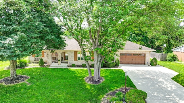 view of front facade with a garage and a front yard