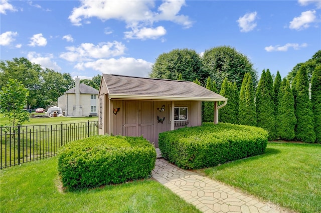 view of outbuilding with a yard