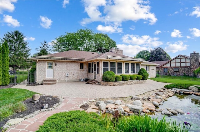 rear view of house with a patio