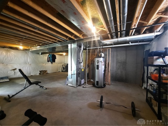 basement featuring heating unit and water heater