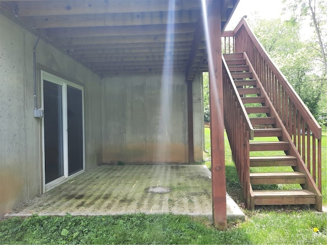 wooden deck with a patio